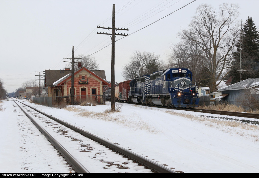 Making their slow crawl through town, 6305 & 6304 roll past the depot with Z127
